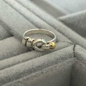 Authentic Tiffany & Co.
Vintage Hook Eye Knot Ring 18K Gold & Sterling Silver